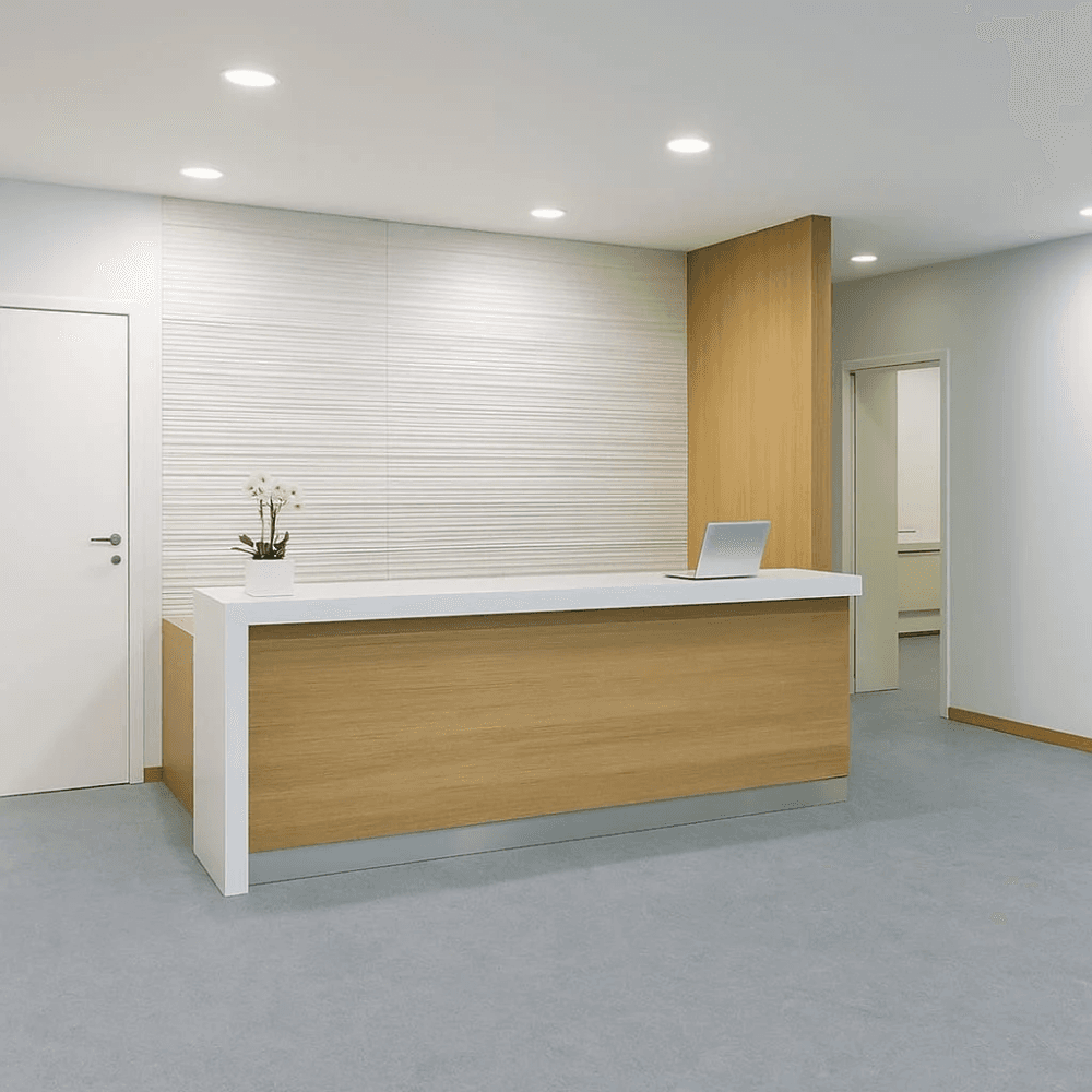 Commercial reception area with light grey vinyl composition tile flooring