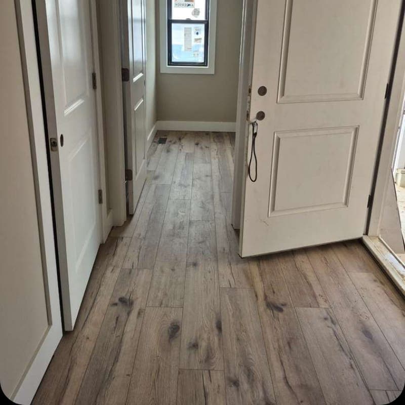 Hallway with freshly installed plank flooring